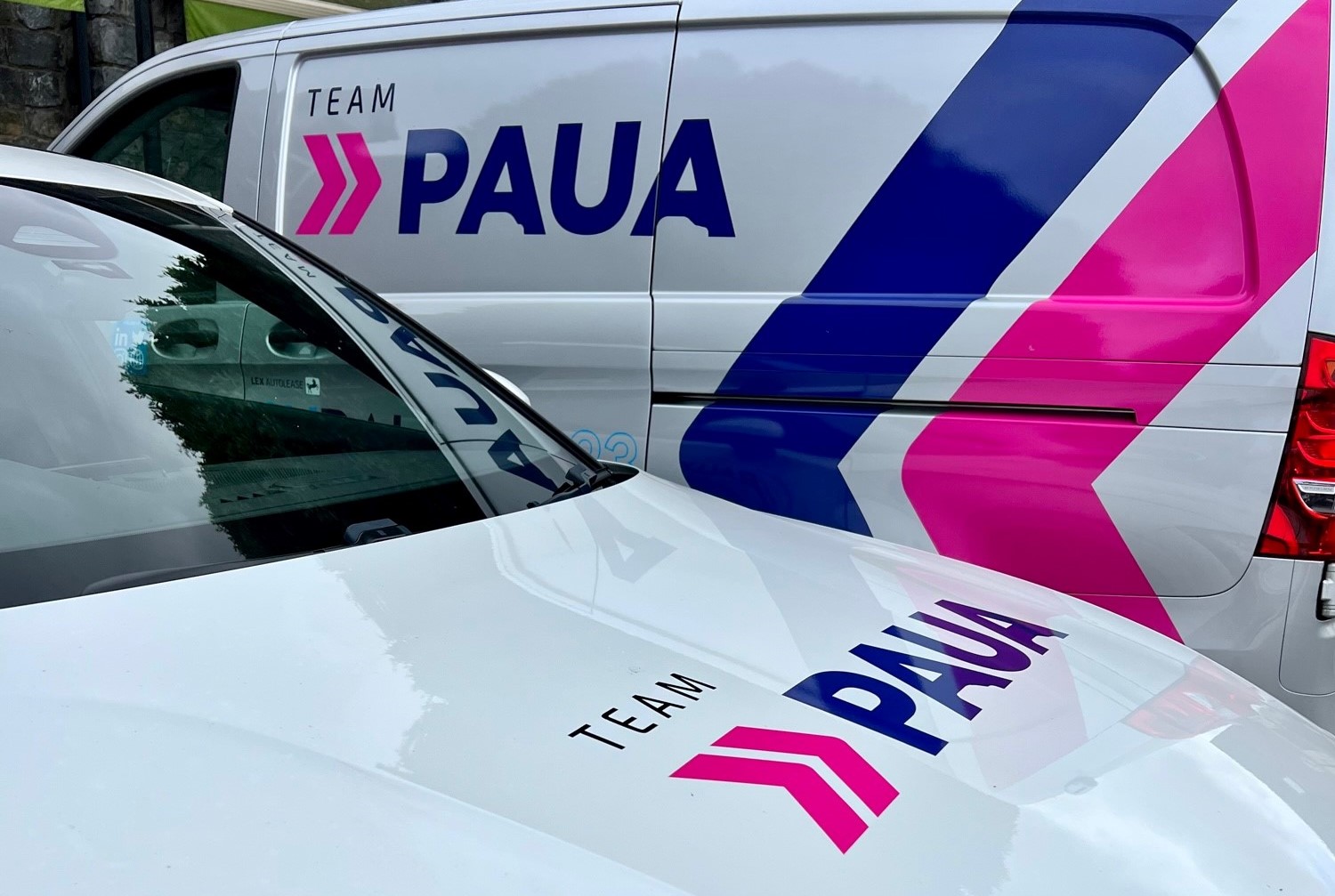 Company fleet electric vehicles parked together charging using the Paua EV Charge Card