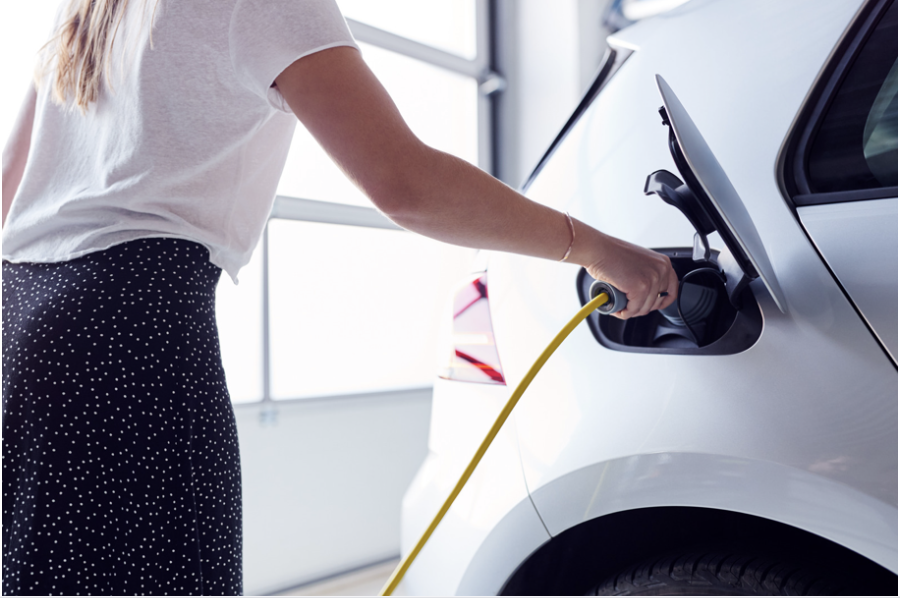 Fleet electric vehicle using a Paua EV Charge Card being plugged into a charger