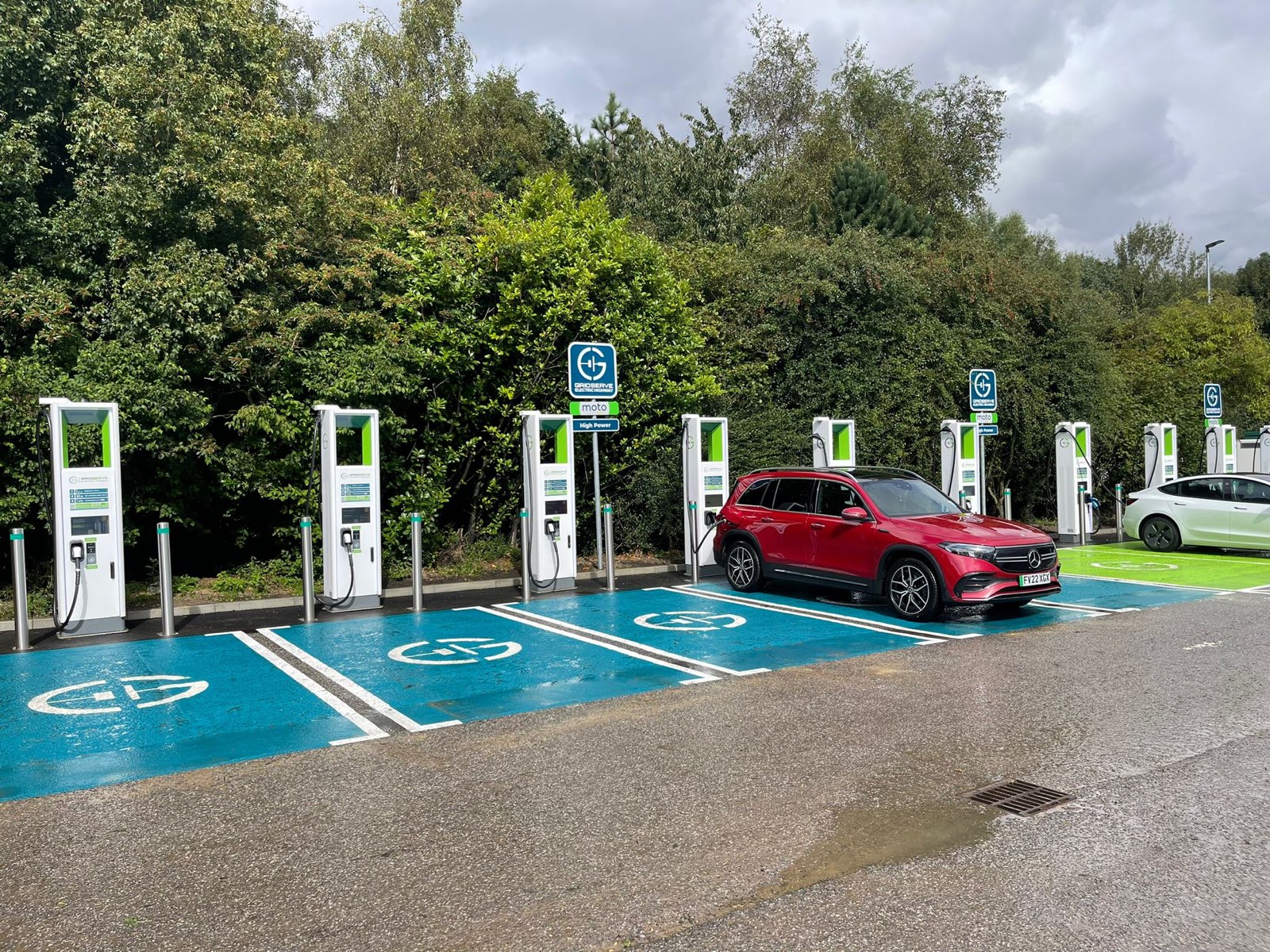 An EV fleet vehicle out charging at a DC high power charging station using Paua EV Charge Card